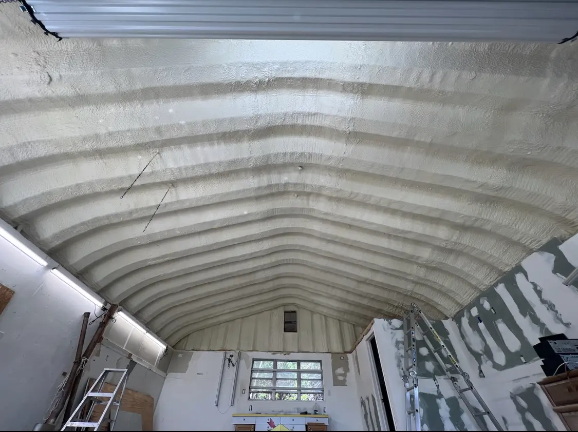Spray polyurethane foam applied to the underside of a metal roof deck in Corvallis